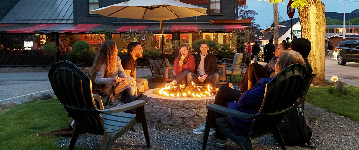 people sitting around a fire